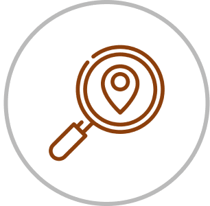 Magnifying glass with location pin icon.