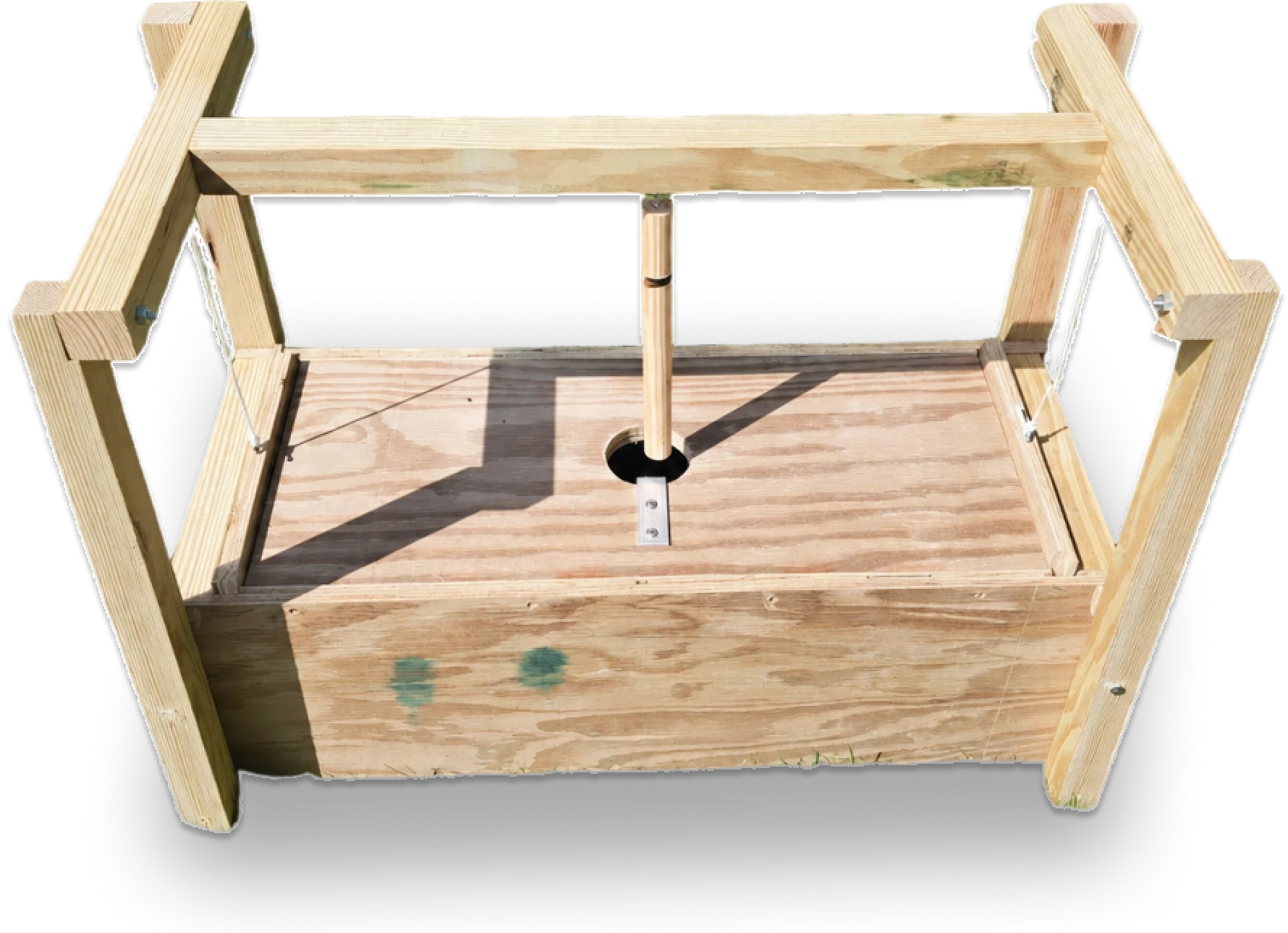 Wooden contraption with central pivot mechanism.